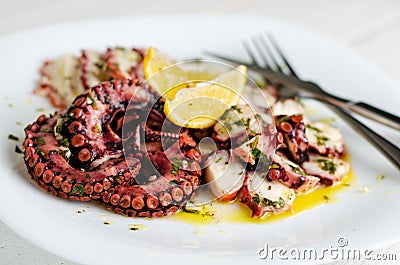 Octopus carpaccio on white background. Mediterranean food, Organic Healthy food Stock Photo