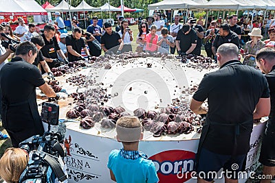 Octopus small chopped bites, street food festival. Seafood festival. Live cooking session contest Editorial Stock Photo