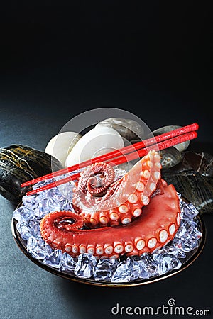 Octopus tentacles on ice Stock Photo