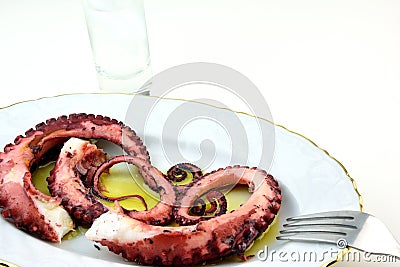 Octopus tentacles meze and ouzo Stock Photo