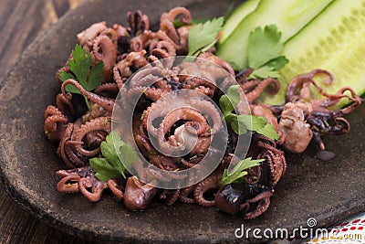 Octopus. Greek, eating. Stock Photo