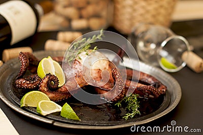 Octopus and wine, traditional Italian cuisine. Tasty food. Seafood. Stock Photo