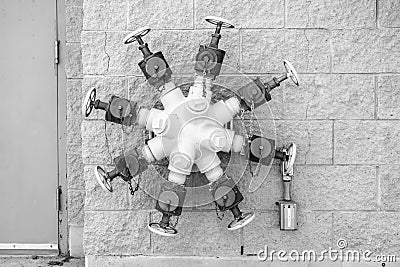 Octuplets Wall Mounted Fire Hydrant Valves Stock Photo