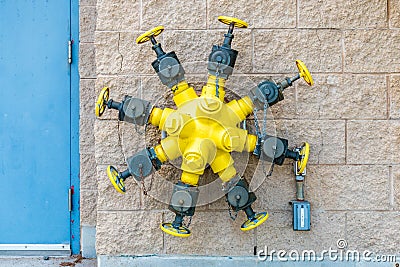 Octuplets Wall Mounted Fire Hydrant Valves Stock Photo