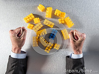 The odd one out with effect on tensed businessman fists Stock Photo