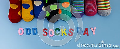 Odd Socks Day. Day lost socks, lonely socks on blue background. Stock Photo