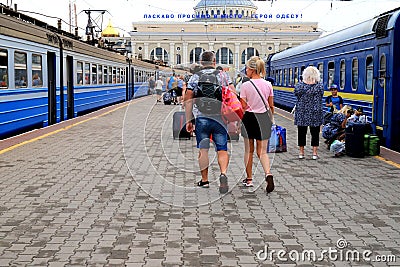 Odesa, Ukraine A crowd of people walking along the platform with bags, suitcases and luggage at the Odessa railway station. Editorial Stock Photo