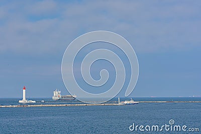 Odessa Commercial Sea Port and Marine Station.Sea entrance to the port, yachts, cargo ships and lighthouse Stock Photo