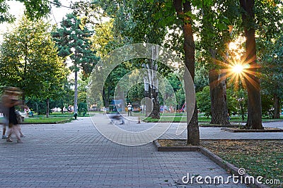 Odessa, Ukraine â€“ August 4, 2020: city Park at the Cathedral square, green trees and people, summer evening Editorial Stock Photo