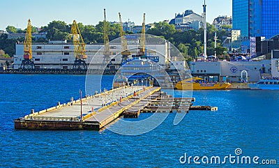 Odessa, Ukraine - August 8, 2018. A pier near a calm sea and sky Editorial Stock Photo