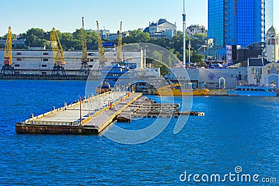 Odessa, Ukraine - August 8, 2018. A pier near a calm sea and sky Editorial Stock Photo