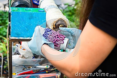 Odessa, Ukraine. August 26, 2019: The process of creating stand for a glass made from recycled plastic. The molten plastic exits Editorial Stock Photo