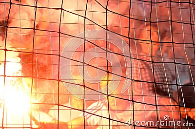 ODESSA, UKRAINE - July 21, 2018: Fans and ultras flare flares for the gate and throw them on the field during the finals of the Editorial Stock Photo
