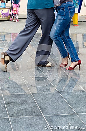 Odessa, Ukraine - July 25, 2019. Green Theater. Ballroom Dance Training. Dancing couple exercising outdoors. Closeup Editorial Stock Photo