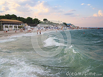 Odessa, Ukraine - June 2019 Glowing bright colored clouds at sunset and a cheerful wave of the Black Sea, Langeron beach Editorial Stock Photo