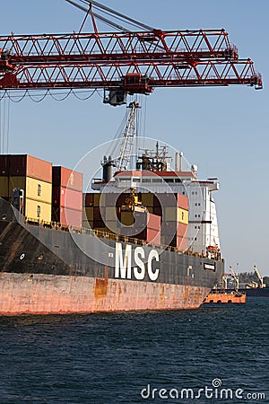 Odessa, Ukraine-202: Logistics terminal sends import-export cargo containers to cargo ship in seaport. Industrial landscape with Editorial Stock Photo