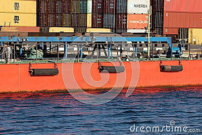 Odessa, Ukraine-202: Logistics terminal sends import-export cargo containers to cargo ship in seaport. Industrial landscape with Editorial Stock Photo