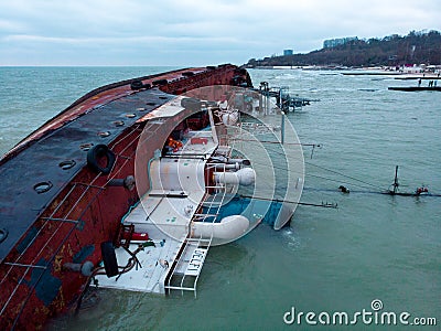 Odessa, Ukraine, November 22, 2019: Shipwreck. The ship crashed near the shore at sea. Cargo tanker. Port. Ecological Editorial Stock Photo