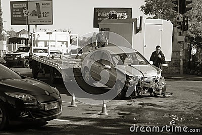 ODESSA, UKRAINE - October 16, 2019: Car accident, head-on collision. A tow truck loads a wrecked car after an accident. Traffic Editorial Stock Photo