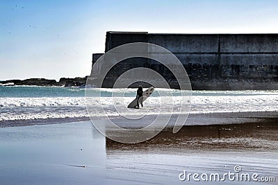 Surfers in Praia da Torre in Lisbon Editorial Stock Photo