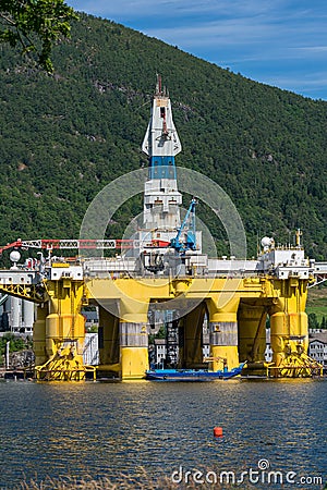 Oilplatform inside the Norwegian fjord for maintance at ships yard Editorial Stock Photo