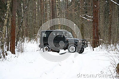 Off-road Action in the forest, 4x4, snow and vehicle Stock Photo