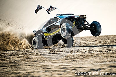 Off road buggy car in the sand dunes of the Qatari desert. Editorial Stock Photo