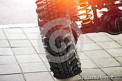 Off-road car tilted show suspension and shock-up Stock Photo