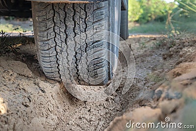 Off road tire on dirt track Stock Photo