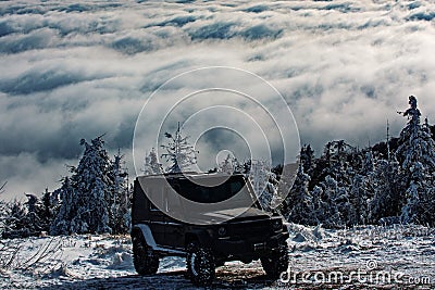 Off-road travel on snow mountain road. Winter ravel concept with 4x4 car. Jeep offroad outdoors adventures. Stock Photo