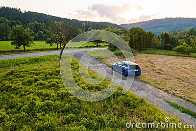 Off road traveling in blue Skoda Scala car at country side road Editorial Stock Photo