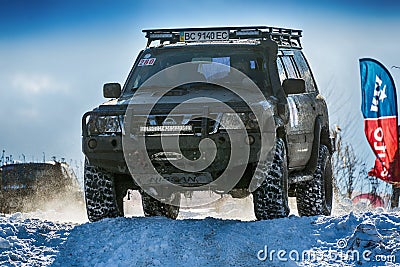Off-road vehicle brand Nissan overcomes the track Editorial Stock Photo