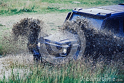 Off-road vehicle stuck on impenetrable road after rain in the countryside. Travel and racing concept for 4x4 drive off Stock Photo