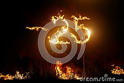 25 OFF sign in glowing sparkler on dark background. Stock Photo
