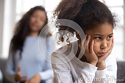 Offended African American preschooler girl looking in distance Stock Photo