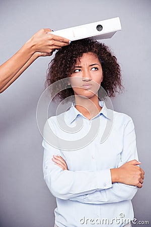 Offended afro american woman stnading with arms folded Stock Photo