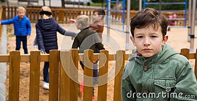 Offended boy on playground Stock Photo