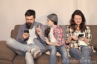 Offended feelings. Stop ignoring kid. Stuck in online. Ignored child. Busy parents surfing internet smartphones. Dad and Stock Photo