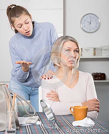 Offended mature woman turned away Stock Photo