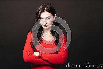 Offended upset woman standing with arms folded Stock Photo