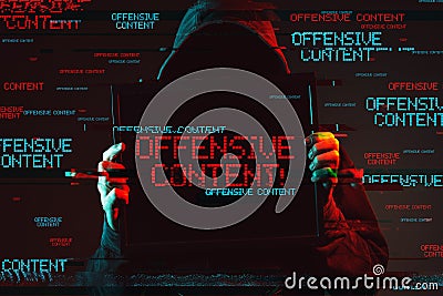 Offensive content concept with faceless hooded male person Stock Photo