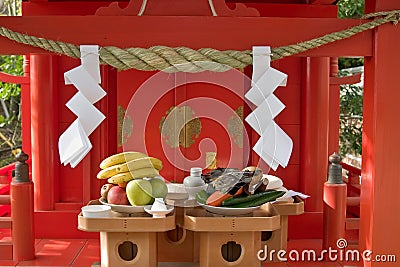 Offerings of food left at a Japanese shinto shrine Stock Photo