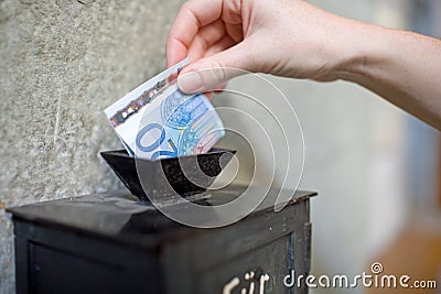 Offertory box in church Stock Photo