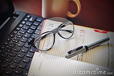 Office calendar with glasses and pen Stock Photo