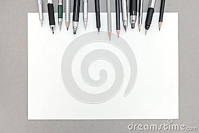 Office desk with blank sheet of paper and various drawing tools Stock Photo