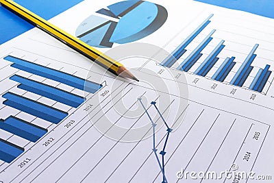 Office desk with charts , histograms and financial documents Stock Photo