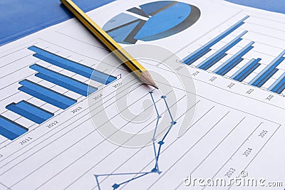 Office desk with charts , histograms and financial documents Stock Photo