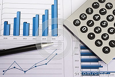 Office desk with charts , histograms and financial documents Stock Photo