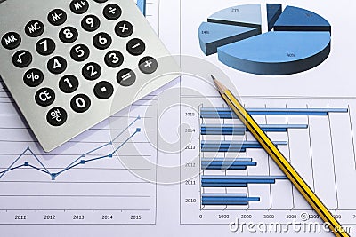 Office desk with charts , histograms and financial documents Stock Photo