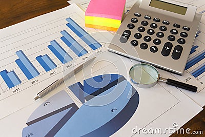 Office desk with charts , histograms and financial documents Stock Photo